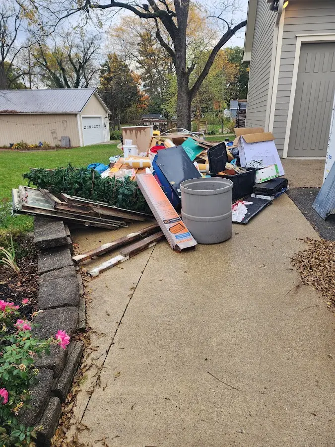 Dumpster being loaded with debris for 12 Yard Dumpster Rental in Ruskin
